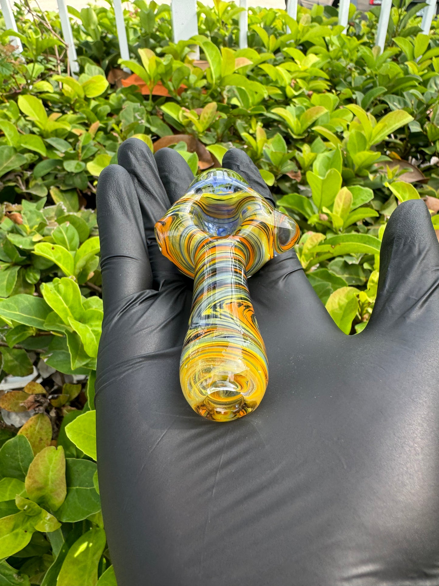 Handcrafted with a vibrant wigwag pattern in yellow, orange, and blue