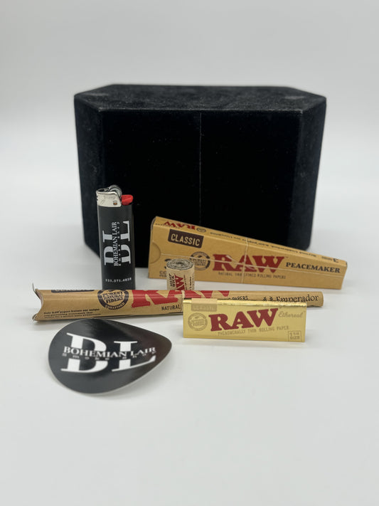 (1) Emperador Raw Pack  (1) 10 ft Raw Hemp Wick  (1) 3 Pack of Raw Peacemakers  (1) Gold Ethereal Raw Pack  (1) Bohemian Lair Lighter