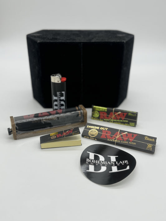 Raw Black Starter Kit. Raw Black, the thinest papers around. includes one pack of 1.25 and one pack of king size papers, a pack of black tips, a Raw Roller and some Bohemian Lair Swag. A Bic lighter and sticker